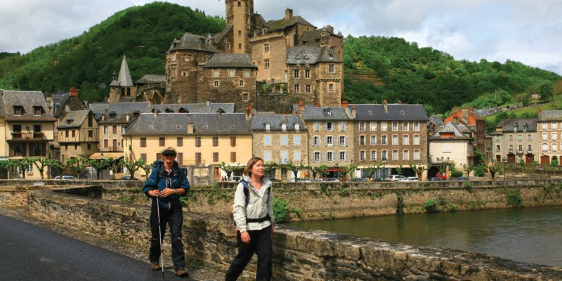 Walkers on the Way of St James, France, leaving Estaing - Walking Tours France